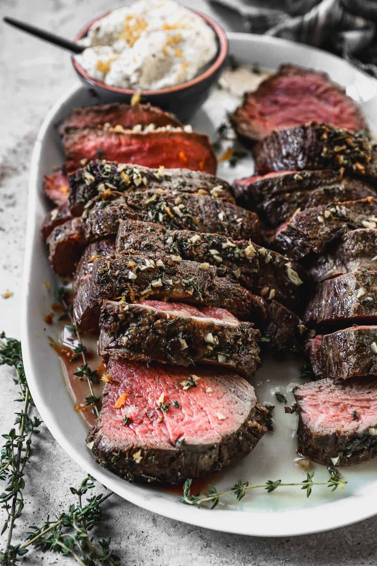 A simple Beef Tenderloin recipe, sliced and placed on a platter, ready to enjoy.