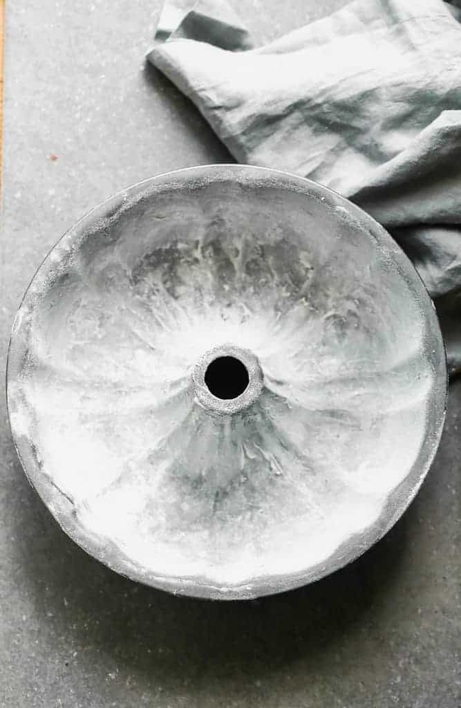 A bundt pan greased with shortening and flour.